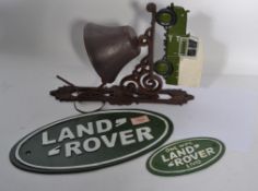 A collection of vintage 20th century cast iron motoring related Land Rover items to include a