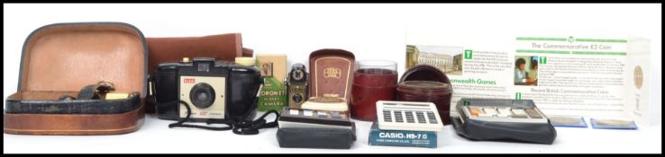 A mixed lot to include vintage Casio calculators, leather case chemists phial glass measure, Coronet