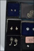 A collection of eight pairs of boxed silver earrin