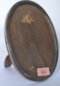 A silver hallmarked easel backed picture frame of oval form being hallmarked for Birmingham 1916.