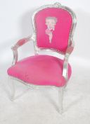 A vintage 20th century Louis French style fauteuil armchair having a painted silver finish with pink