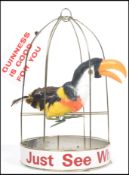 An original vintage 20th century Guinness advertising piece in the form of a Toucan with real