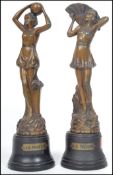 An early 20th century pair of cold painted bronze spelter Art Deco figurines of dancing girls,