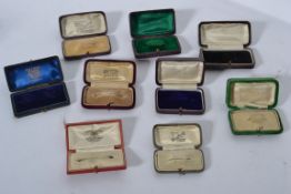 A collection of antique vintage jewellery brooch boxes to include Ham and Huddy Cornwall,