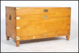 19th Century camphor wood trunk with brass and wooden bandings and iron end handles. Measures: