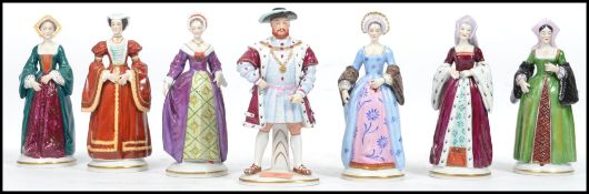 A set of seven Continental porcelain Sitzendorf figures to include Henry VIII and his six wives,