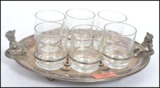 A silver plated six person coffee / drinks set consisting of six glass tumblers in mounts on an oval