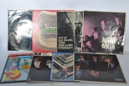 A collection of vinyl long play LP record albums to include The Beatles and The Rolling Stones -