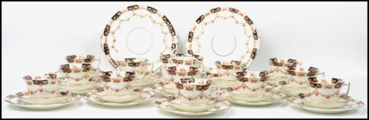 A Victorian  19th century china 12 person setting tea service. The service in a hand finished floral