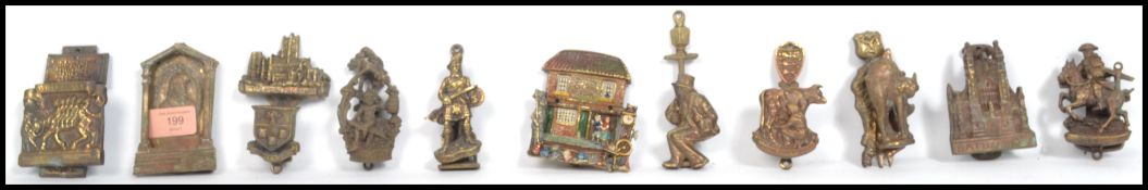 A collection of 19th century Victorian brass pictorial and novelty door knockers to include Rob