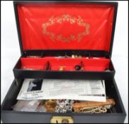 A collection of costume jewellery to include brooches, beads, pearl necklaces, clip on earrings,