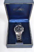 A Seiko 5 gentleman's stainless steel automatic wristwatch with day and date aperture, luminous