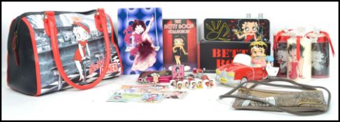 A good collection of Betty Boop related items, to include handbag, purse, bank notes, watches,