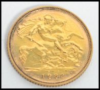 A 20th century gold half sovereign coin dating to 1982,  weighs 3.99 grams. Measures 2 cm diameter.