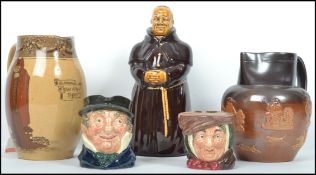 A collection of early to mid 20th century Royal Doulton items to include a water Royal Doulton