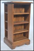 A contemporary Ercol elm wood pedestal entertainment stand cabinet ideal for CD storage having