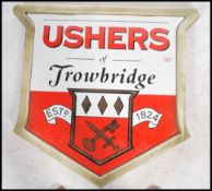 A vintage 20th century advertising point of sale pub sign for Ushers of Trowbridge having a red