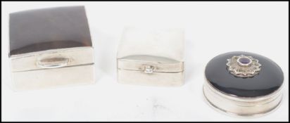 Two vintage 20th century silver pill boxes one of rectangular form having a faux tortoise shell lid,