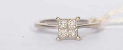 A 9ct white gold ladies 4 stone diamond ring having claw mounted 4 square cut stones approx