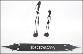A pair of 20th century African fine carved wooden tribal figures from Tansania along with a Kariba