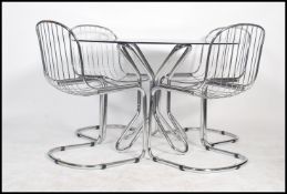 A 1970's chrome dining table and chairs in the manner of Harry Bertoia. 4 good chrome cantilever
