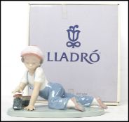 A Lladro ceramic figure titled 