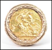 A 1979 full gold sovereign ring set in a hallmarked 9ct gold large naturalistic brutalist ring mount