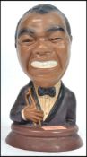 A retro 20th century circa 1970's chalk-ware bust of Louis Armstrong, painted finish with original