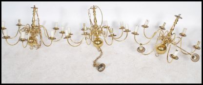 A set of 3 20th century antique style polished brass chandeliers, each with ball finials having