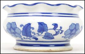 A 19th century Oriental ceramic blue and white incense bowl having a flared scalloped rim and