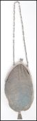 An early 20th century Alpaca silver white metal ladies evening purse of mesh construction with