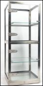 A retro vintage 20th century industrial steel and glass display cabinet fitted with three shelves