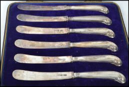 A set of six early 20th century Edwardian silver hallmarked pistol grip butter knives by Atkin