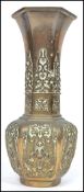 A Oriental Chinese bronze vase of bulbous hexagonal dorm having dragon decoration to the body with