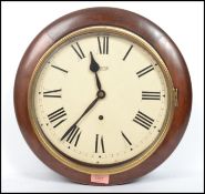 A early 20th century oak cased station clock by Smiths, enamel face with roman numeral chapter ring.
