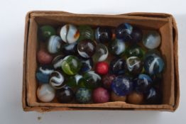 A good group of Victorian and other glass marbles to include cat eye, onion skin etc. Please see