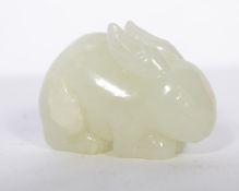 A 20th century  white jade carving of a rabbit, hunched on all fours measuring 4.5cms