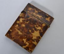 A 19th century tortoise shell card case having a button lock with hinged lid opening to reveal a