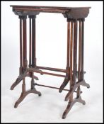 A Regency 19th century rosewood harlequin nest of tables, each of graduating size being raised on