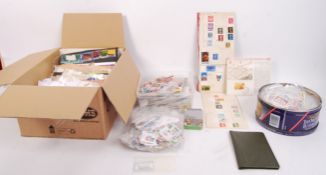 POSTAGE STAMP accumulation. Box and carrier bag packed with stamps, loose, on paper, covers and