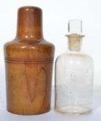 A 19th century glass medicine bottle with square cut stopper complete in original twist top olive