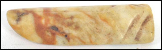 A Chinese early 20th century carved white  and russet brown jade pendant being of lozenge form