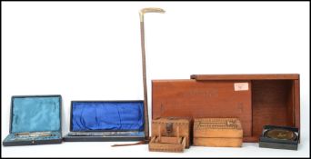 A presentation cased Victorian silver button hook and shoe horn together with cased nutcrackers,