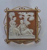 A hallmarked 9ct gold cameo brooch. The cameo depicting Artemis and Apollo set in a square mount