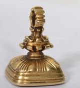 A 14ct gold 19th century intaglio fob seal having a circular bail atop with wasted and scrolled