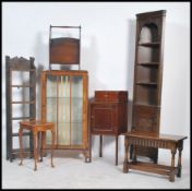 A collection of furniture to include an open bookcase, china cabinet, magazine rack, corner
