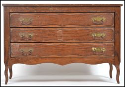 A 20th century apprentice piece / salesman French commode chest of drawers having three drawers with