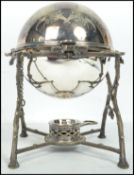 A late Victorian / early Edwardian silver-plated egg coddler and burner with bird nest support,
