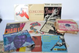 A collection of vintage 78rpm shellac and long play vinyl records predominately jazz records by