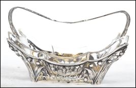 A stunning silver Art Nouveau inspired silver ( marked 800 ) fret pierced bon bon dish, glass